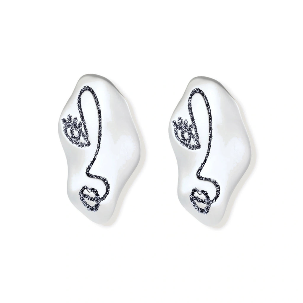 Artistic ear-shaped earrings with minimalist face line art on clear eco-zinc alloy base with sterling silver posts.