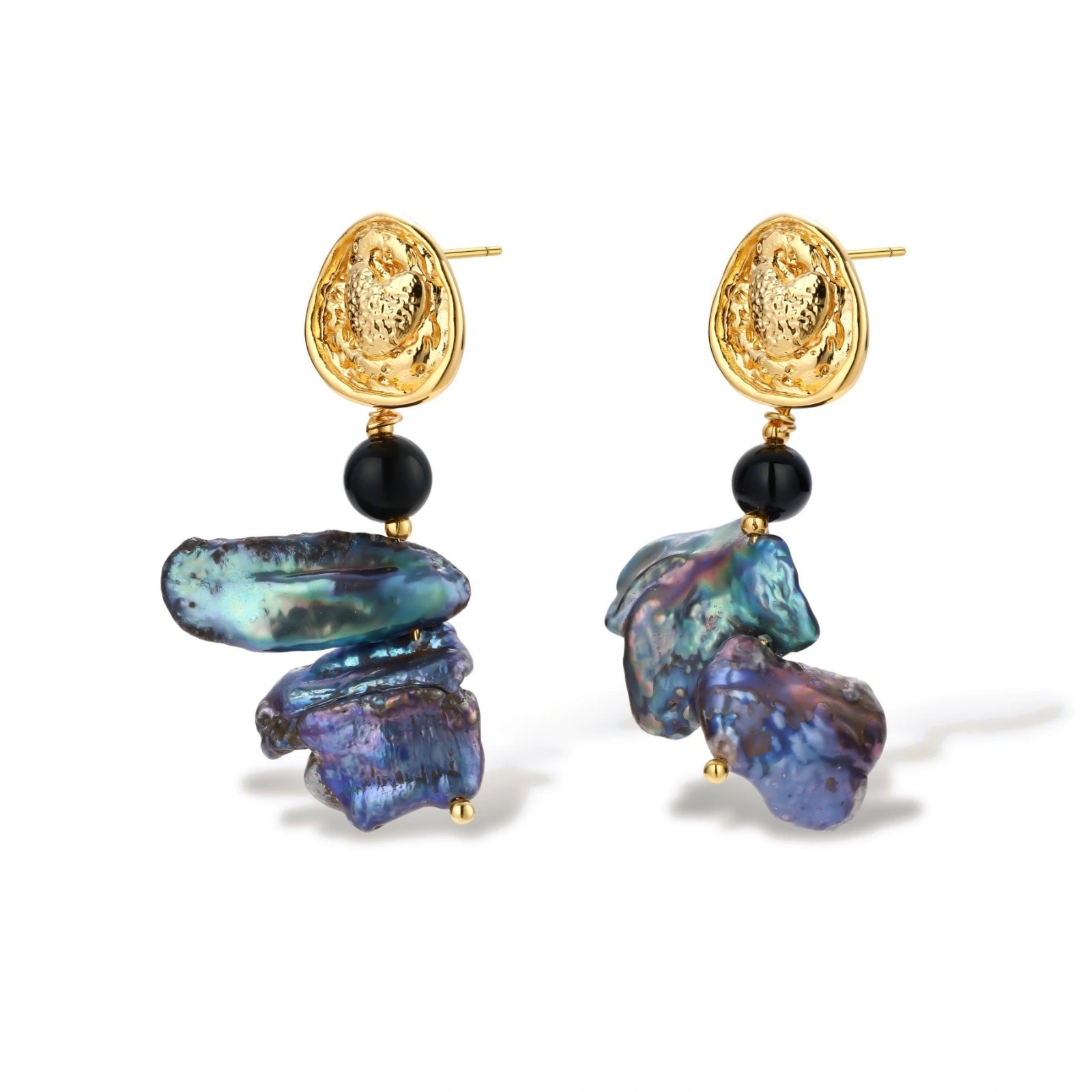 Ornate gold-plated drop earrings with black beads and iridescent blue-purple baroque pearls against white background.