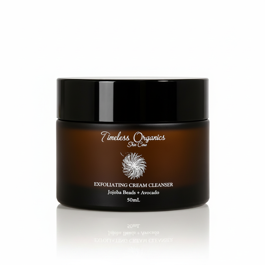A 50mL jar of Timeless Organics Skin Care Exfoliating Cream Cleanser, featuring a dark amber brown jar and a glossy black lid, set against a warm beige background with soft diagonal light shadows.