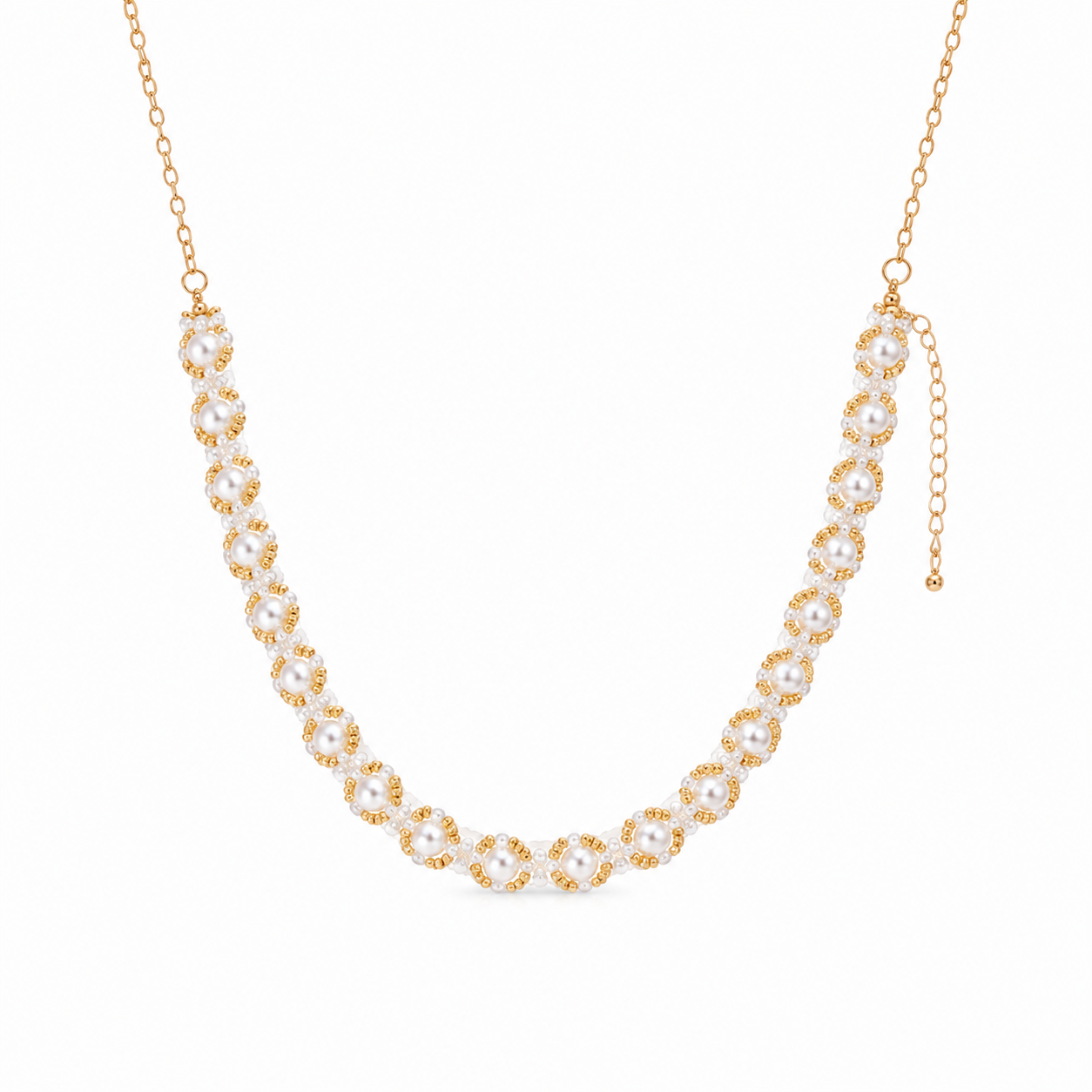 A gold chain necklace featuring a curved row of pearl-like round beads surrounded by small gold floral accents, displayed on a clean white background.