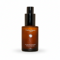 An amber glass bottle with a black pump dispenser, labeled 'Puerar Organic' and 'Oil-Free Spot Treatment', set against a warm beige background.