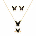 Butterfly necklace and earrings set on a white background