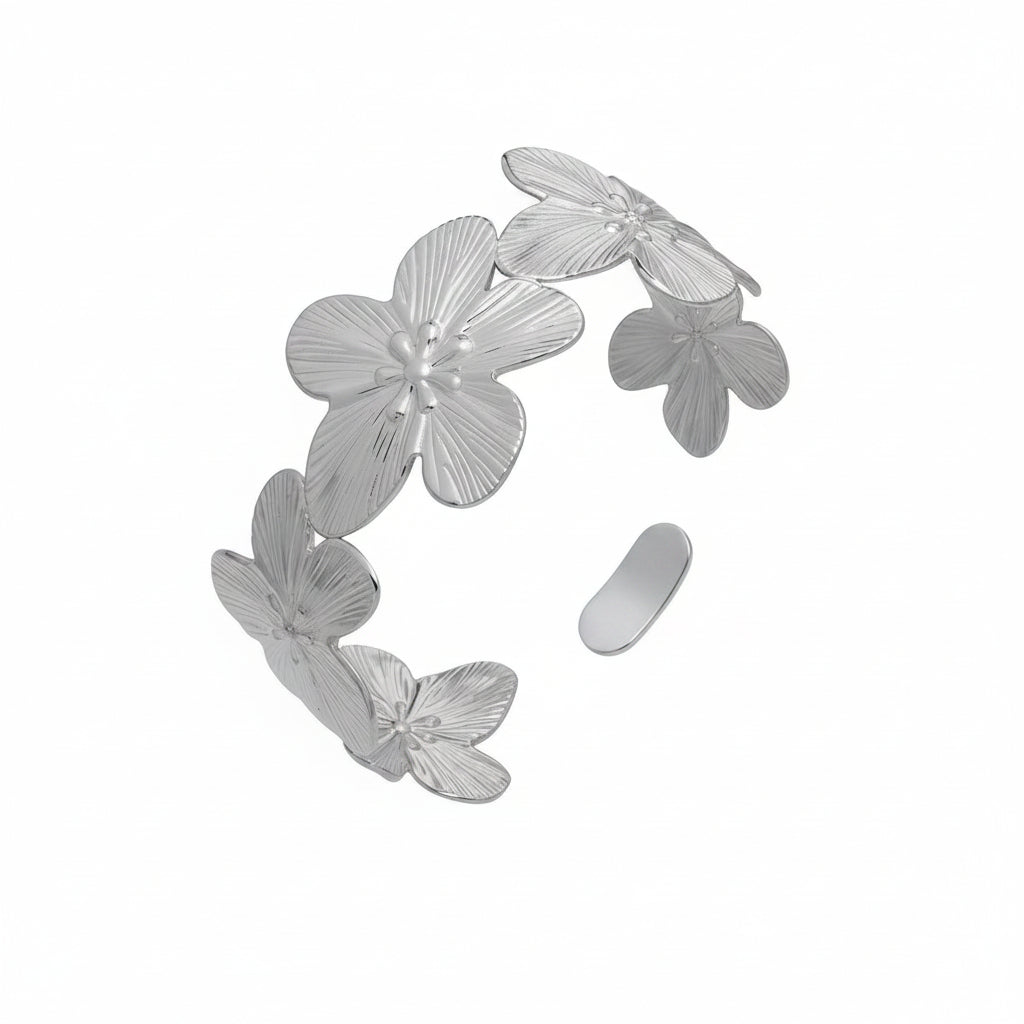 Floral-shaped earring with measurements and product details on a white background