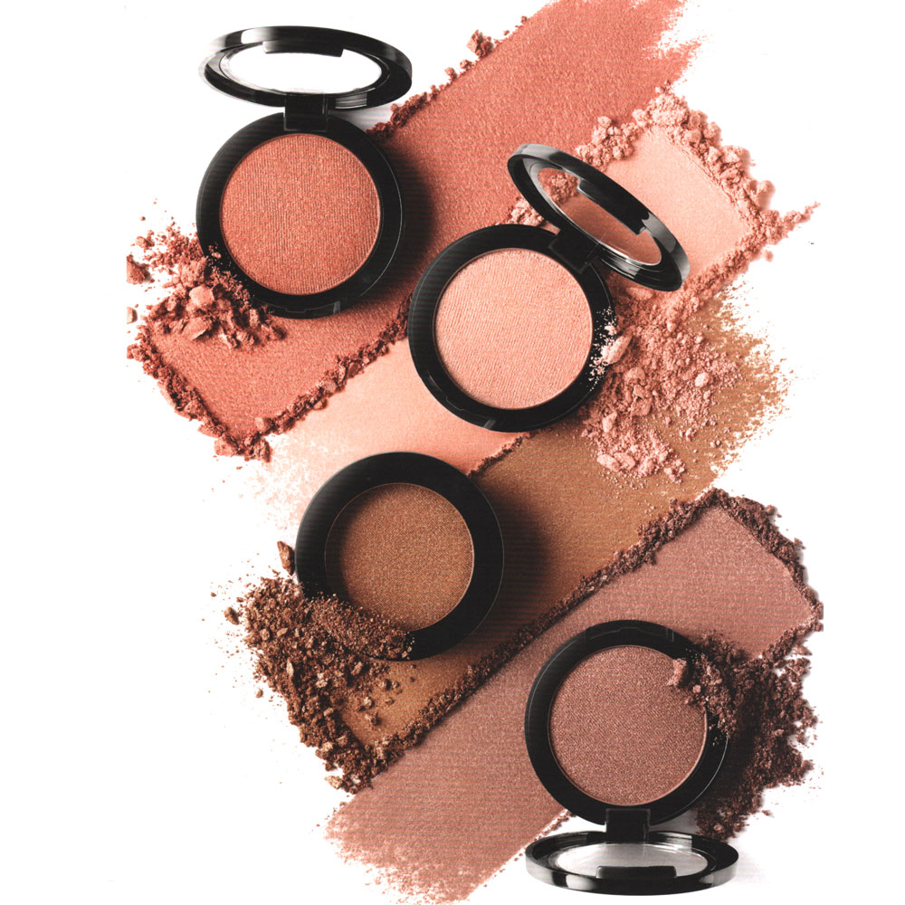 Four compact blushes with visible powder on a white background