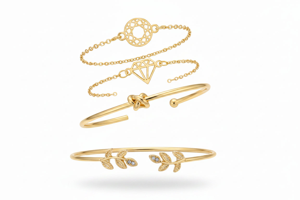 Gold bracelets on a wrist with a neutral background