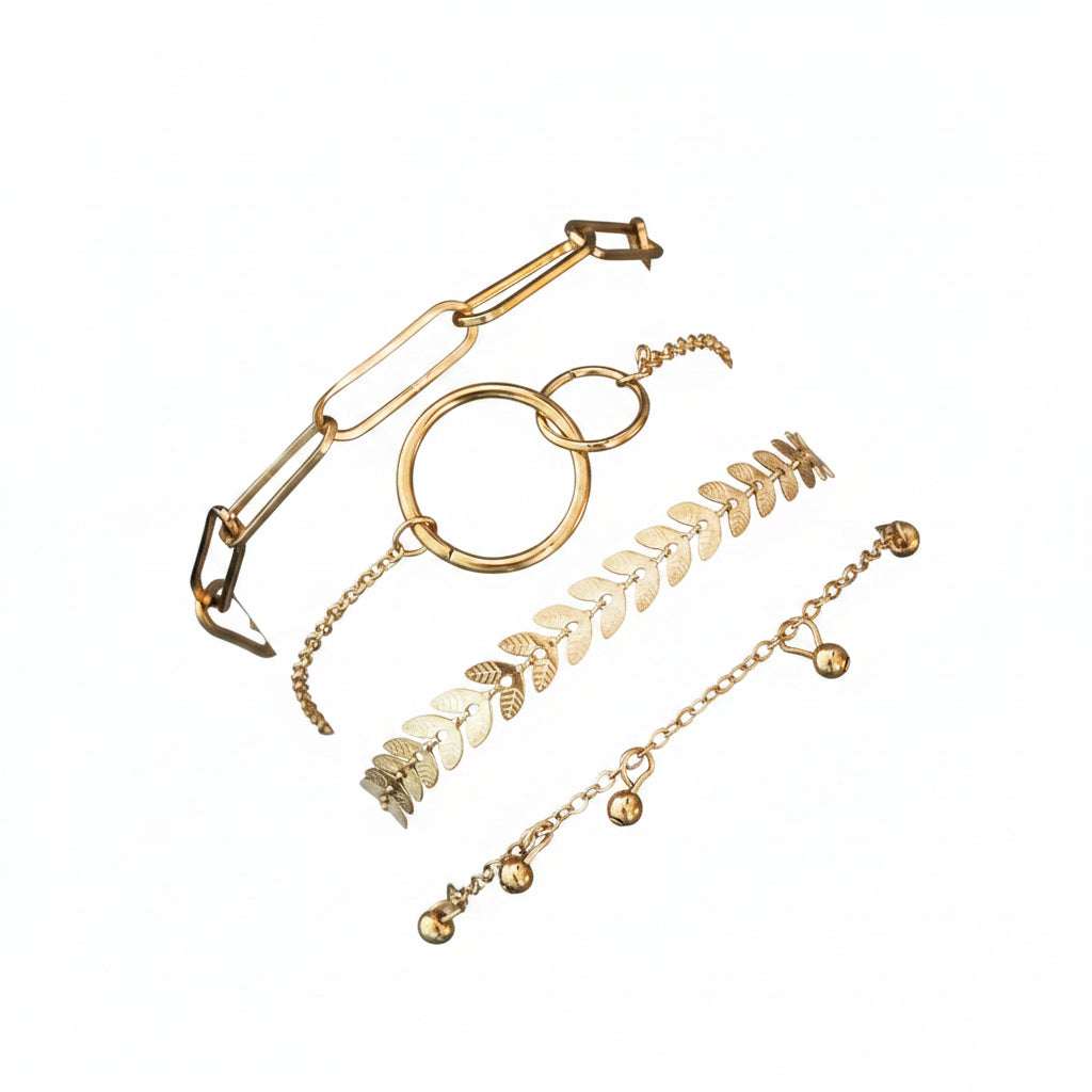 Gold bracelets on a wrist with a white background