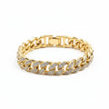 Gold chain bracelet with diamond accents on a dark background