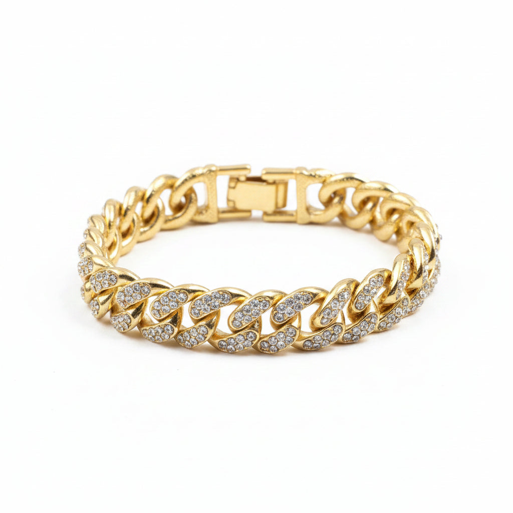 Gold chain bracelet with diamond accents on a dark background