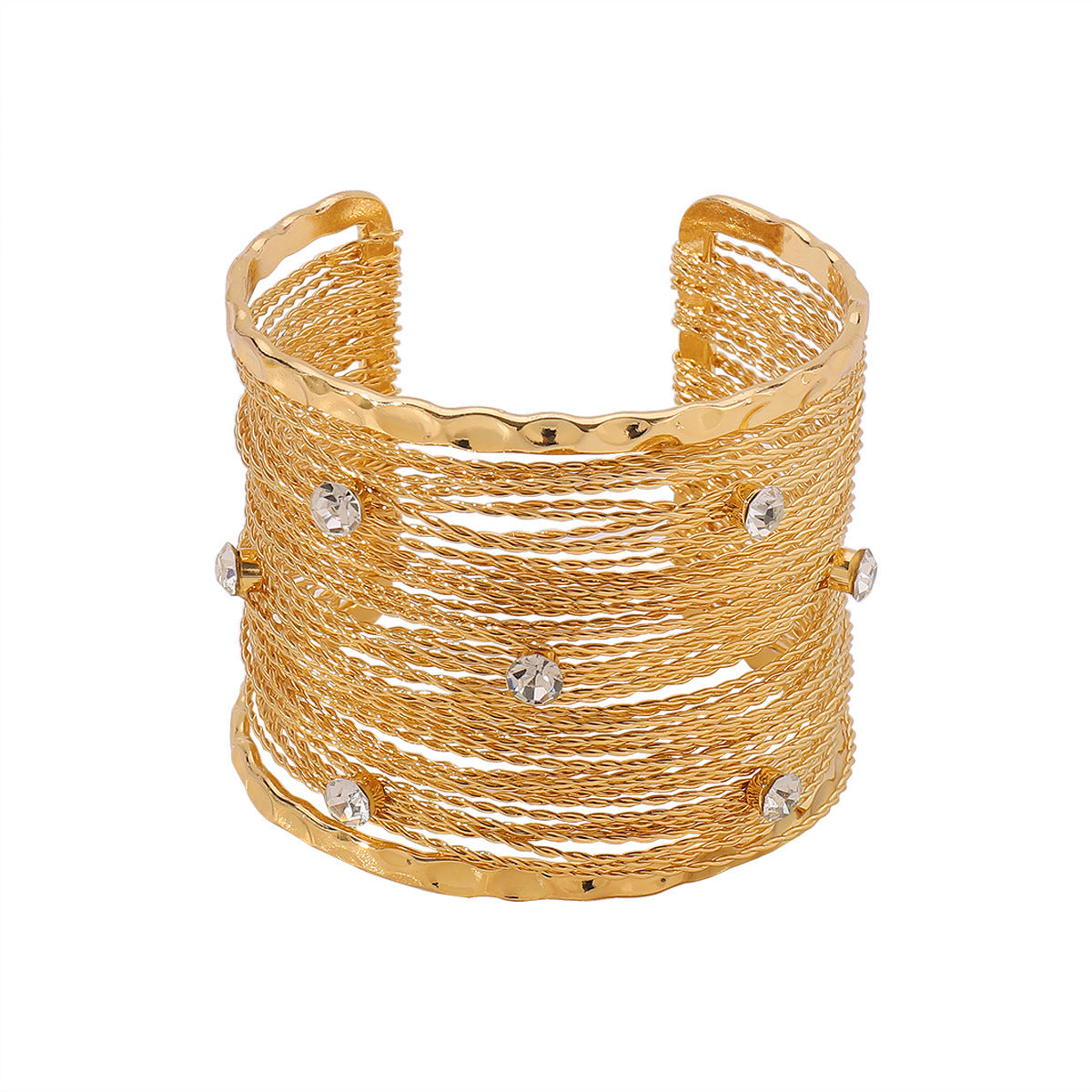 Gold cuff bracelet with small crystals on a white background