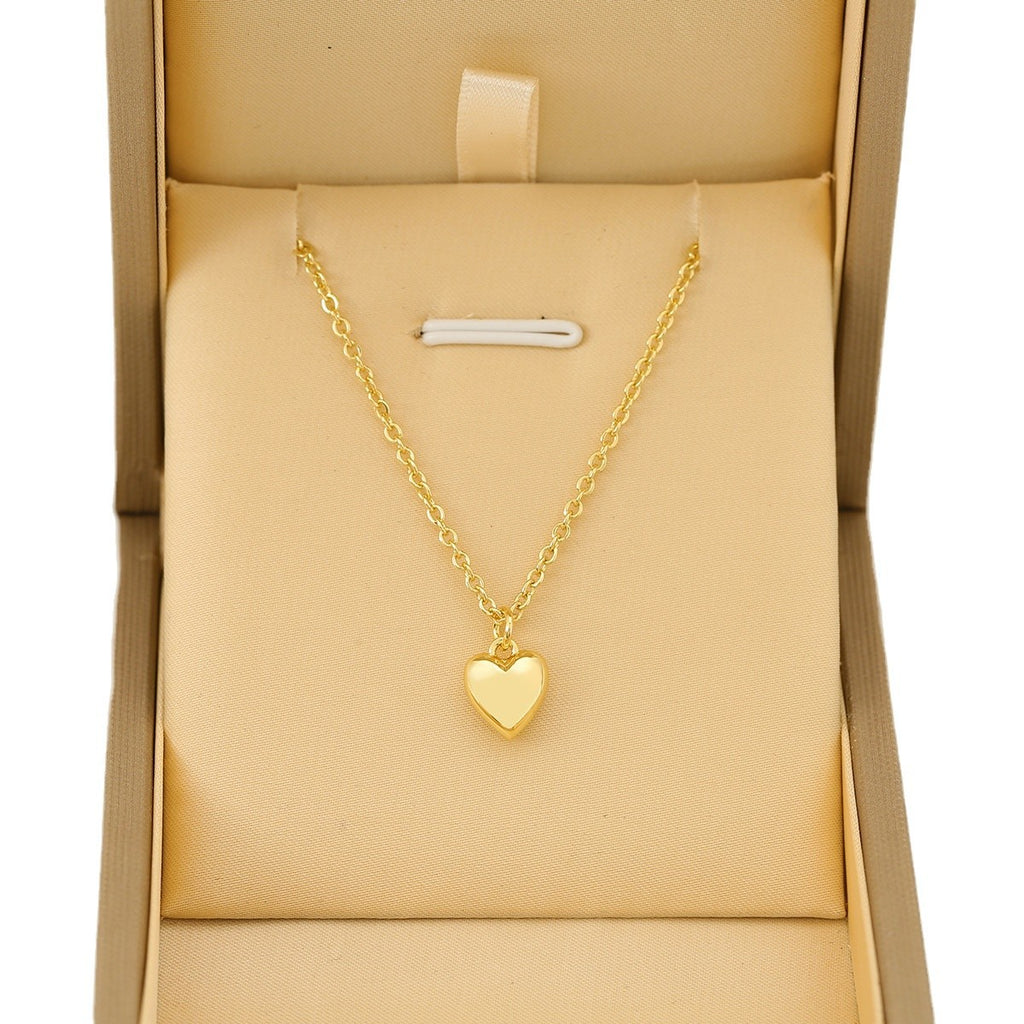 Gold heart-shaped pendant necklace.