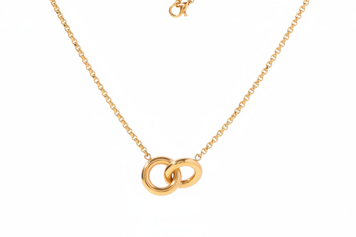 Gold necklace with interlocking rings, showing measurements and weight on a white background.
