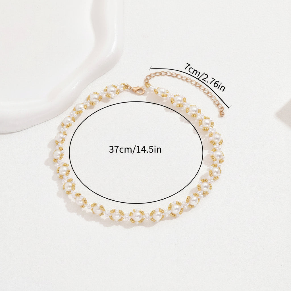 Gold necklace with measurements on a white background
