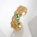 Gold ring with a green 