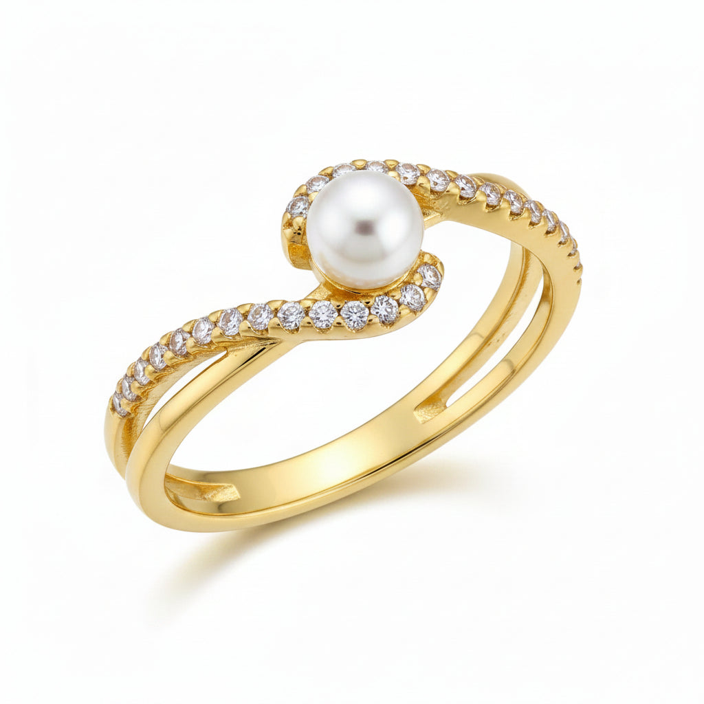 Gold ring with a pearl and crystals on a white background