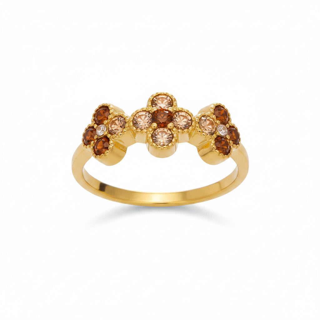 Gold ring with zircon stones and measurements on a white background