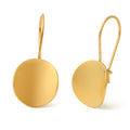 Gold round earrings on a white background