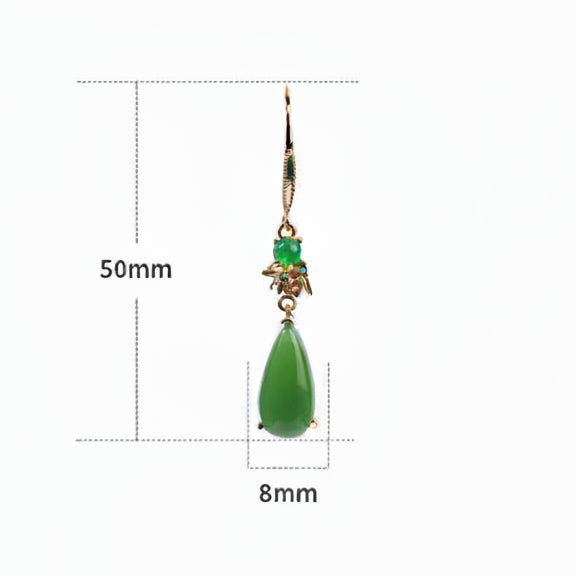 Green pendant with measurement details on a white background