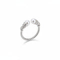 Hand wearing a silver ring with pearls on a neutral background, featuring the brand 'Tao Si Zhu'.