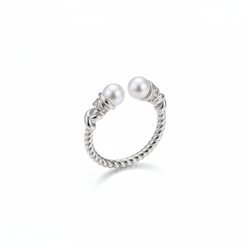 Hand wearing a silver ring with pearls on a neutral background, featuring the brand 'Tao Si Zhu'.