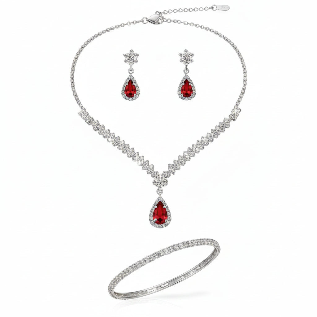 Jewelry set with necklace, earrings, and bracelet on a model against a neutral background
