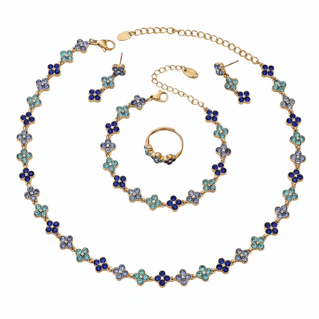 Jewelry set with necklace, earrings, and ring on a light background