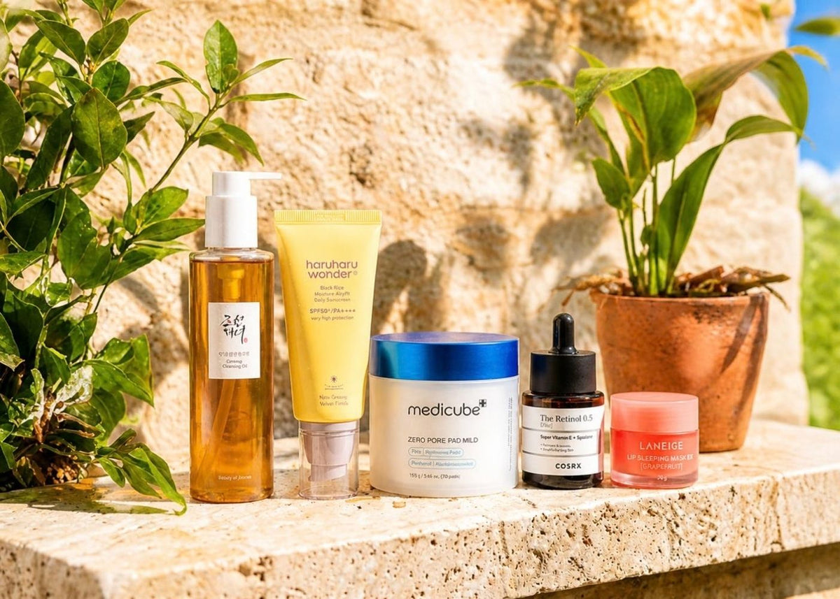 Skincare and makeup products on a marble shelf