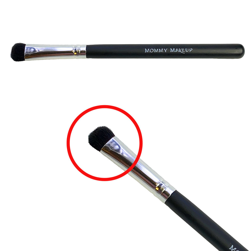 Makeup brush with 'Mommy Makeup' branding on a white background