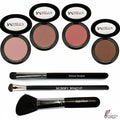 Makeup products including blushes and brushes on a marble surface with 'Wicked Women' branding.