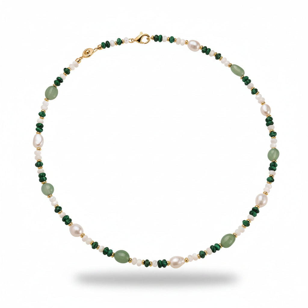 Necklace with green and white beads on a beige display box