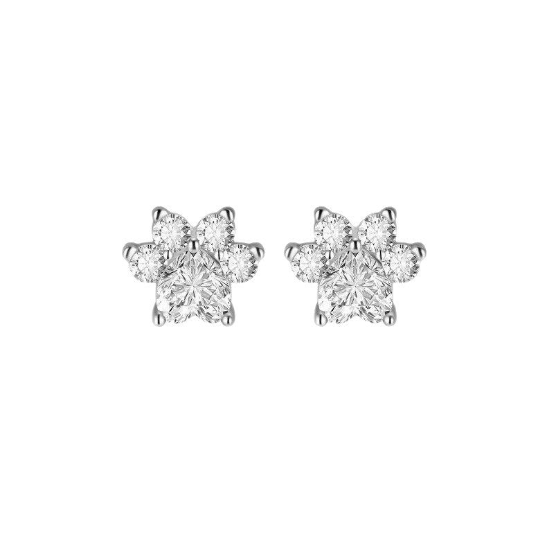 Pair of diamond flower-shaped earrings on a white background
