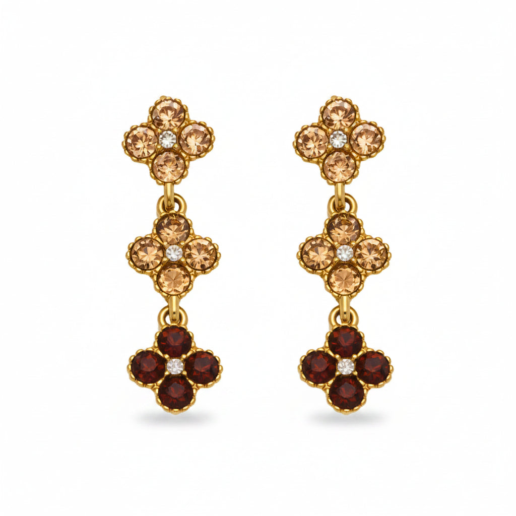 Pair of floral earrings with brown and red stones, labeled for materials and measurements.