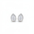 Pair of silver earrings with white stones on a light beige background