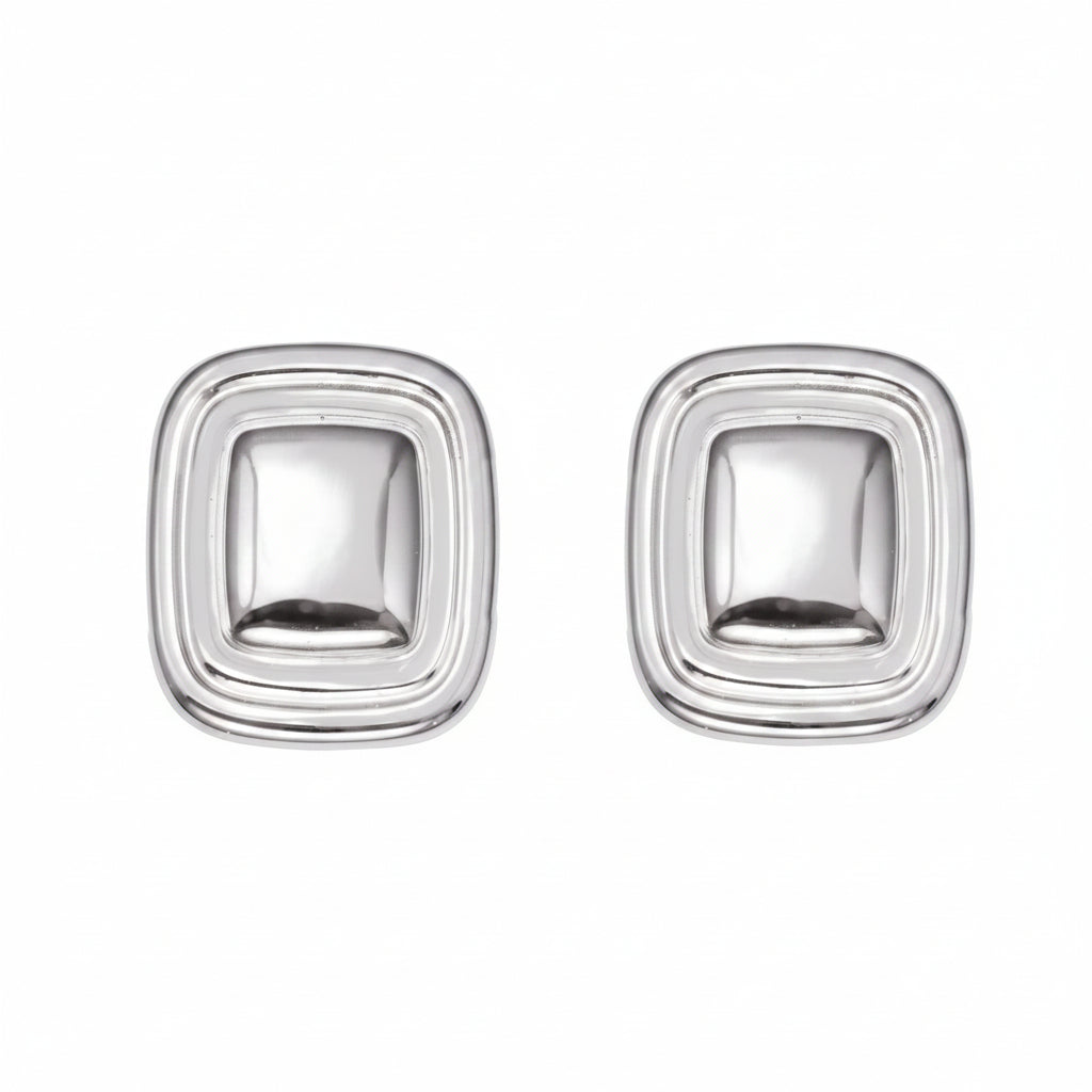 Pair of silver square earrings with measurements and material details on a white background