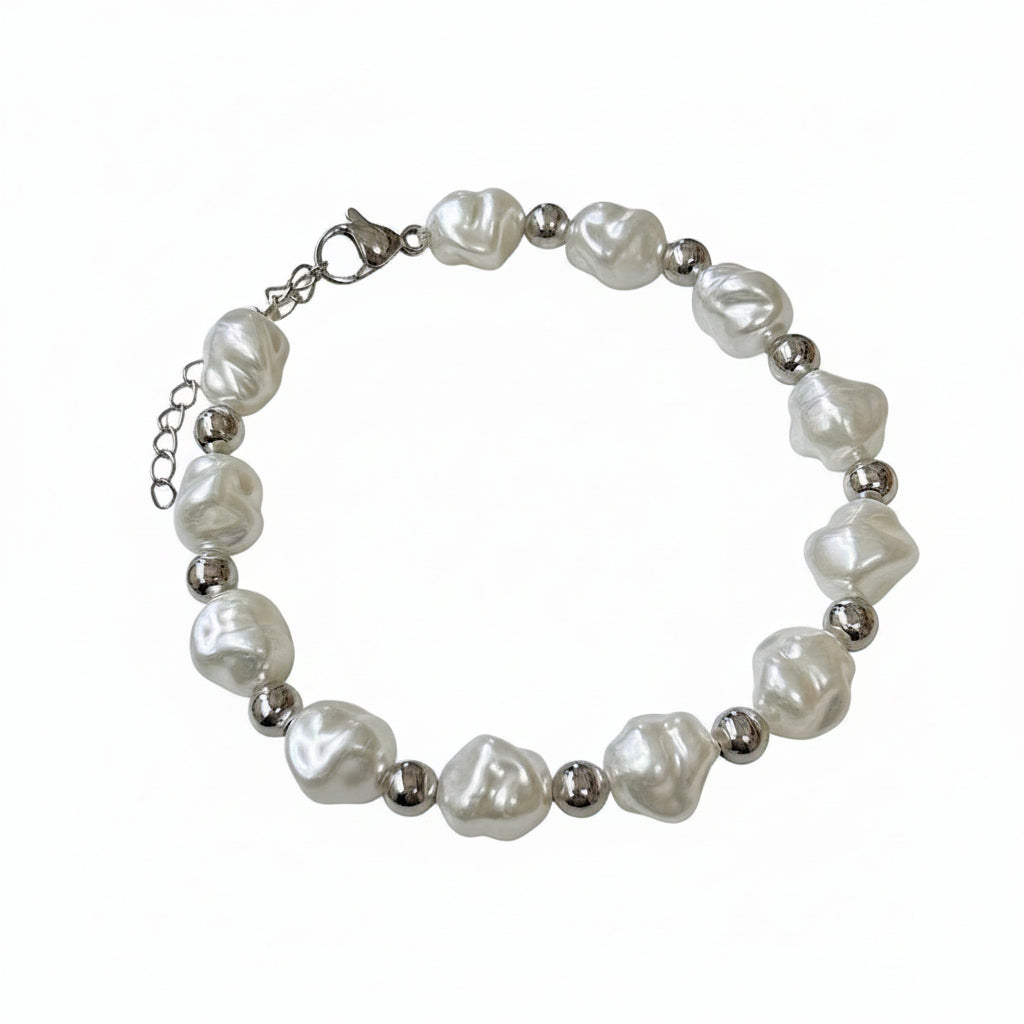 Pearl bracelet with silver beads on a white surface