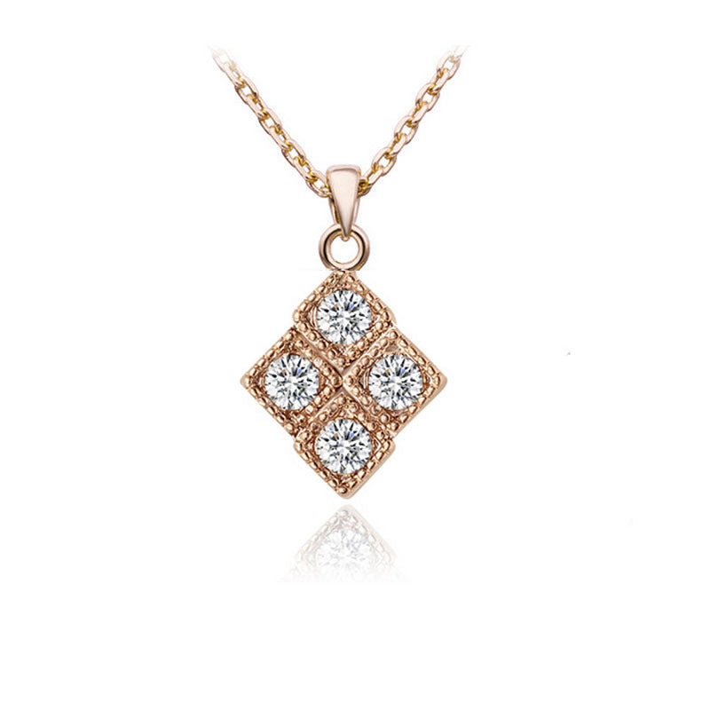 Rose gold necklace with a diamond pendant on a white background