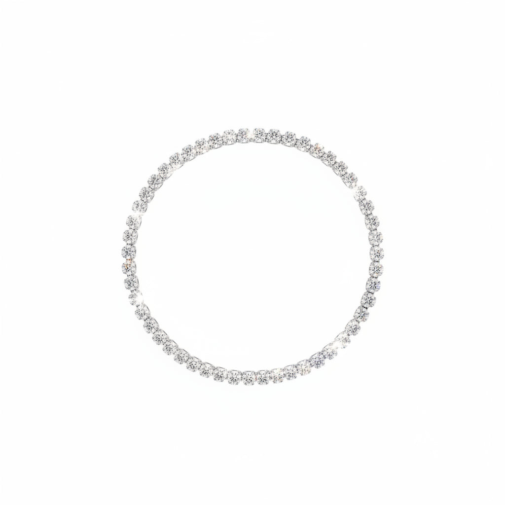 Silver bracelet on a wrist with a neutral background