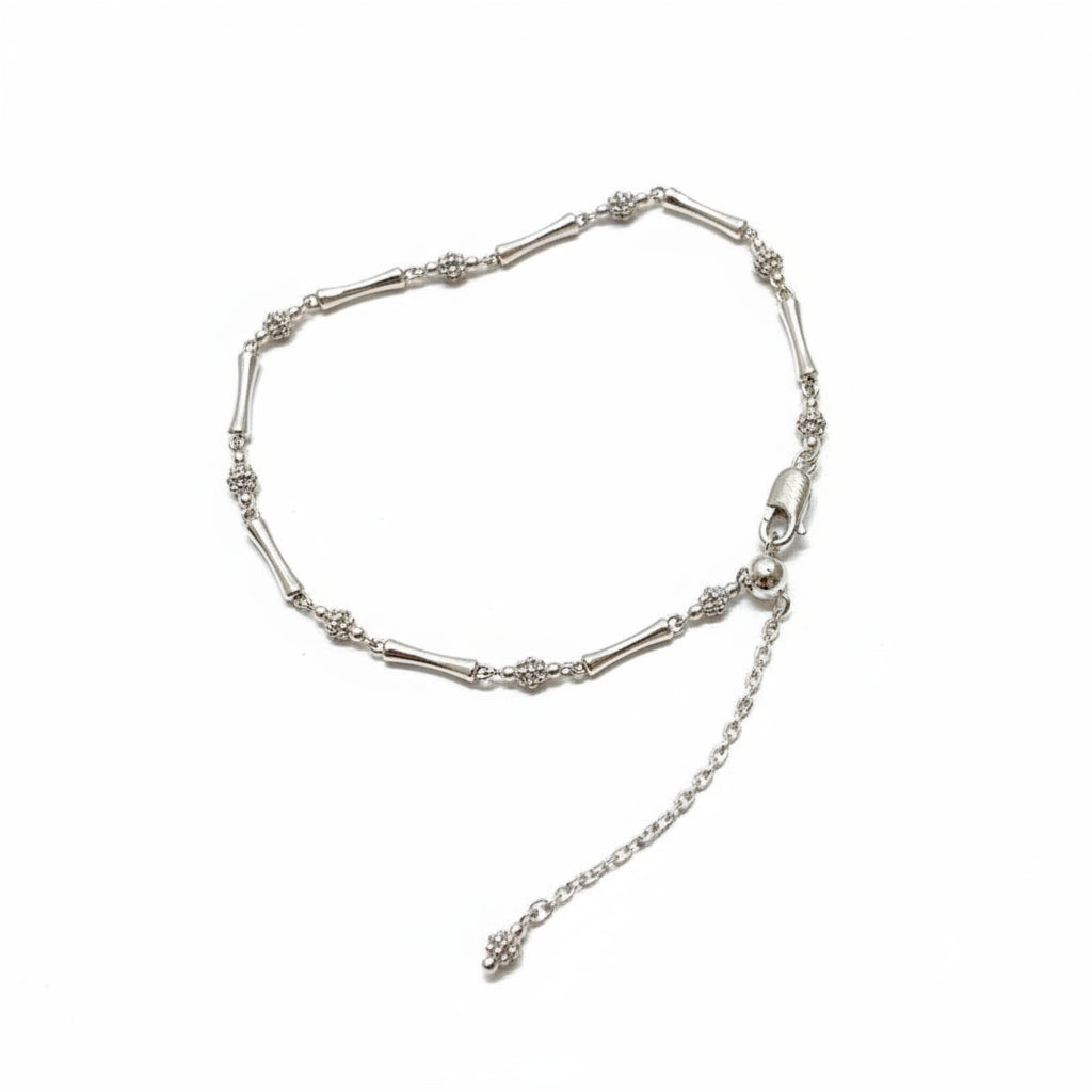 Silver bracelet with a chain extension on a withe background