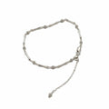 Silver bracelet with a chain extension on a withe background