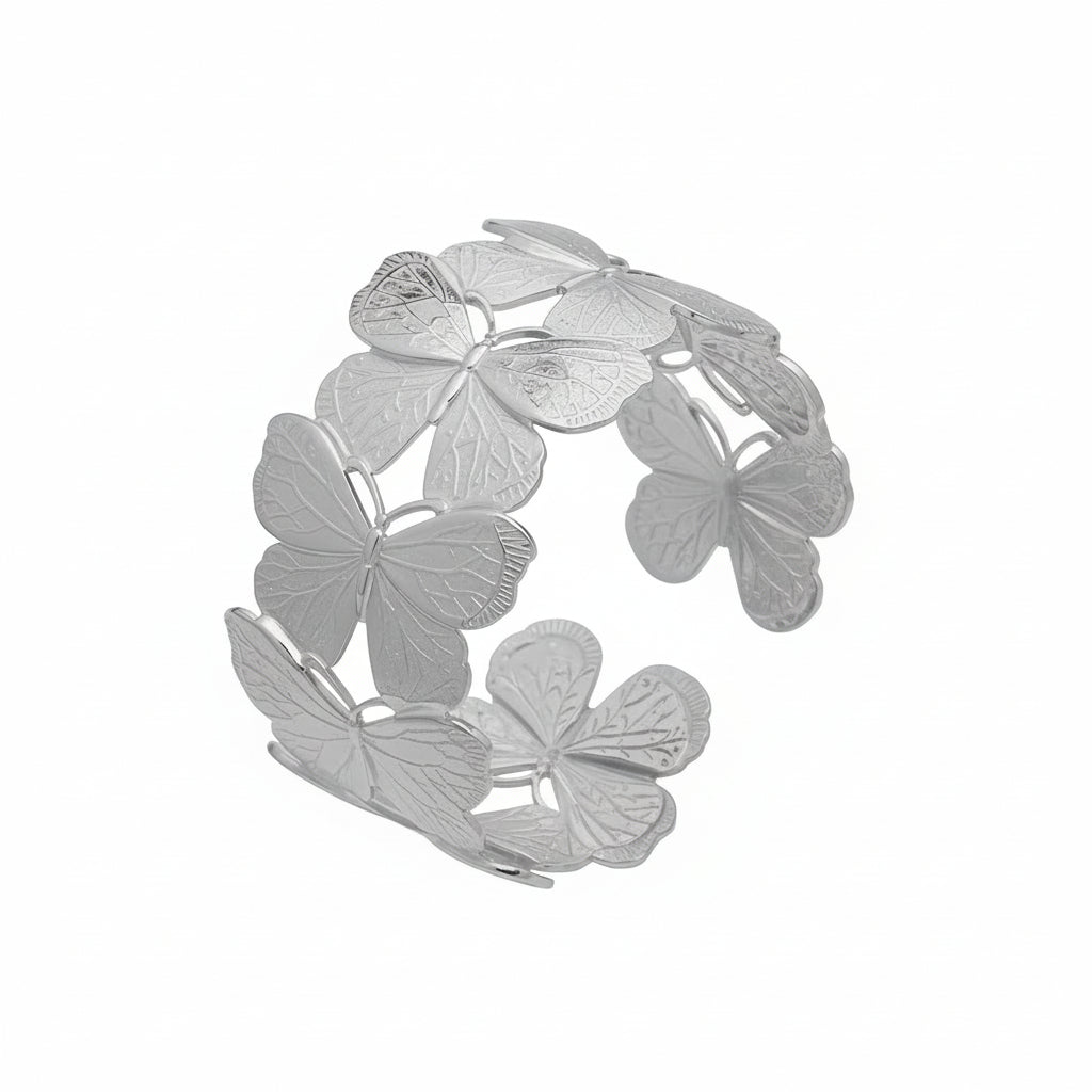 Silver butterfly-shaped bracelet with measurements and material details on a white background