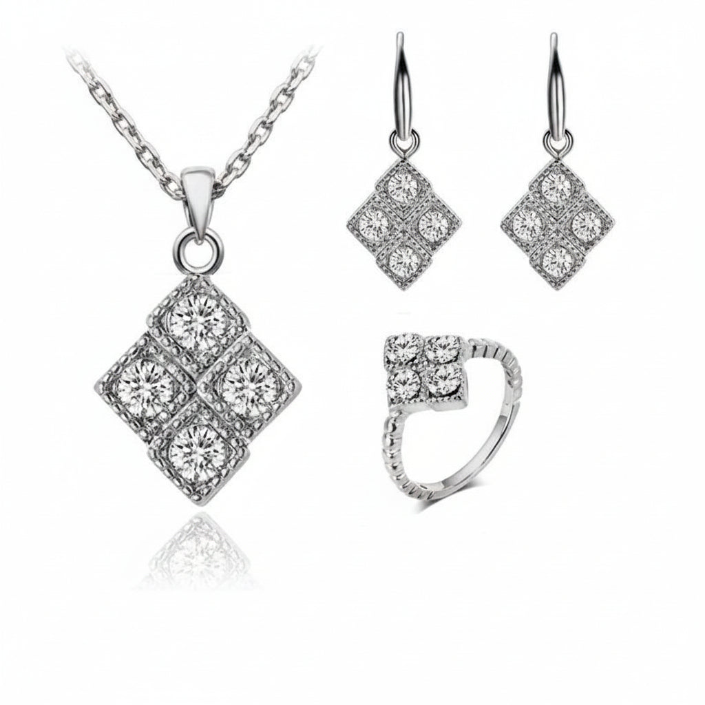 Silver jewelry set with necklace, earrings, and ring on a white background