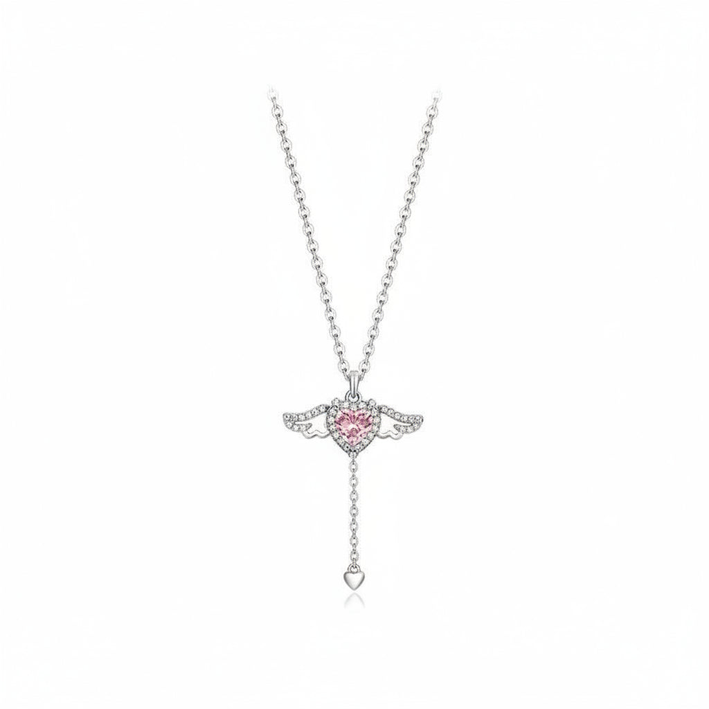 Silver necklace with a pink heart-shaped pendant on a white background