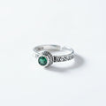 Silver ring with a green gemstone 