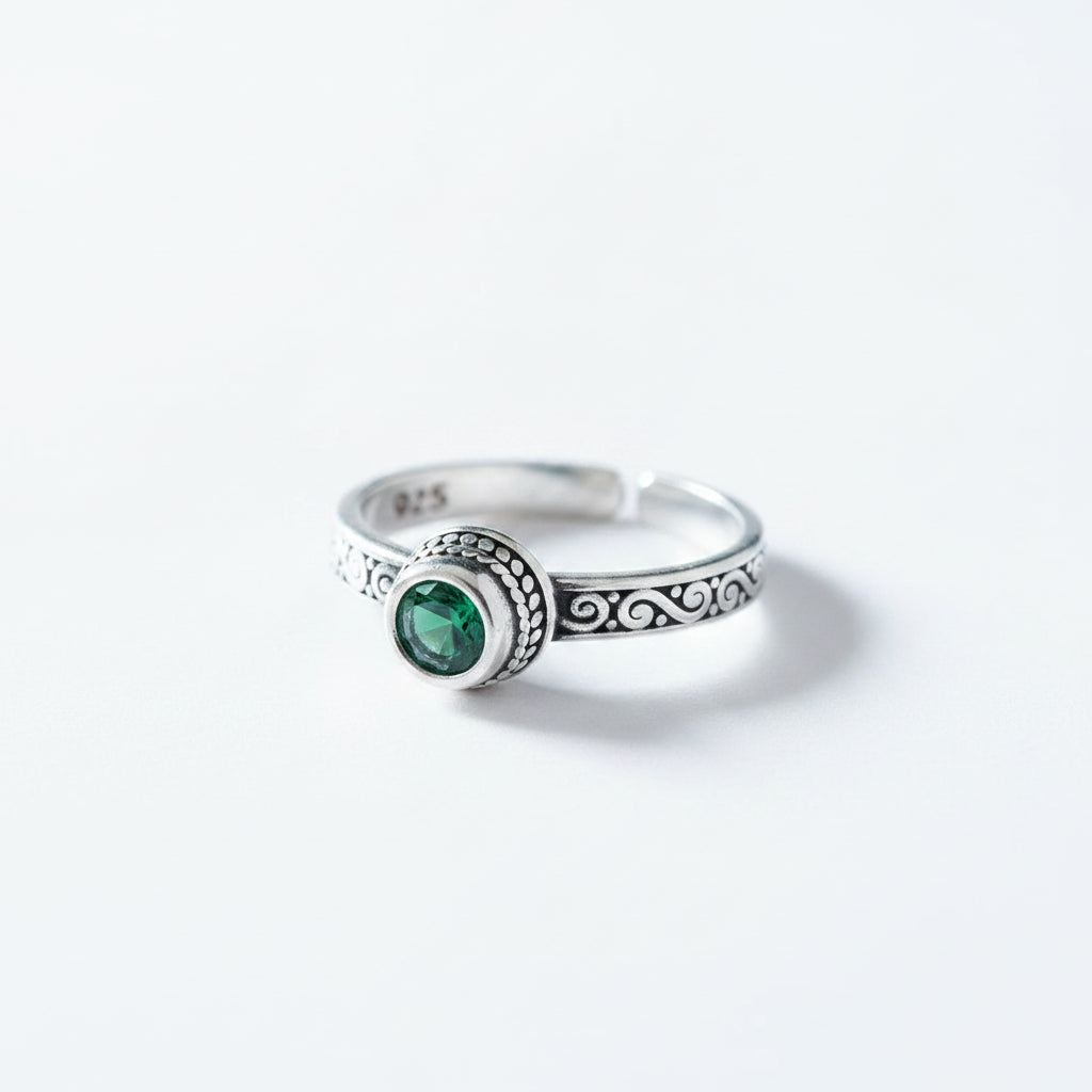 Silver ring with a green gemstone 