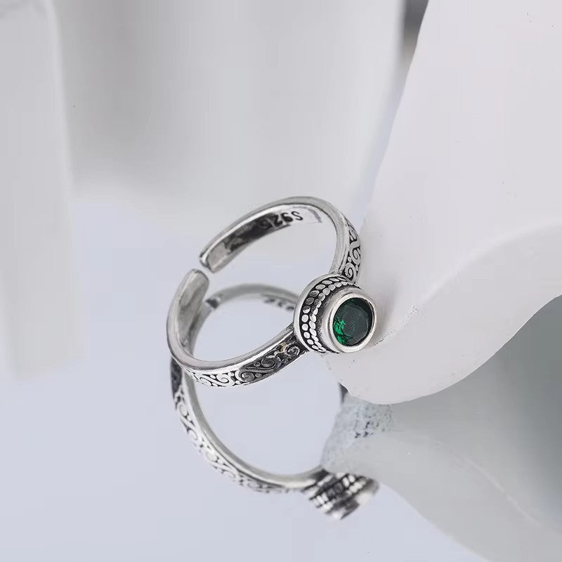 Silver ring with a green stone