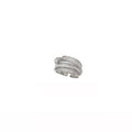 Silver ring with multiple bands on a white background