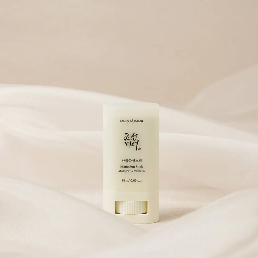 Skincare stick on a soft beige background