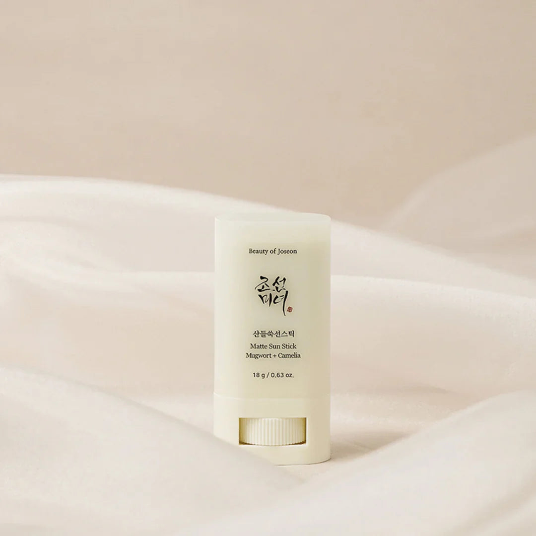 Skincare stick on a soft beige background