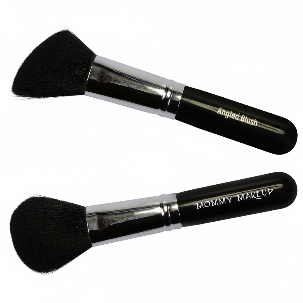 Two makeup brushes with black bristles and silver handles on a white background, labeled 'Angled Blush' and 'Mommy Makeup'.