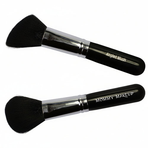 Two makeup brushes with black bristles and silver handles on a white background, labeled 'Angled Blush' and 'Mommy Makeup'.