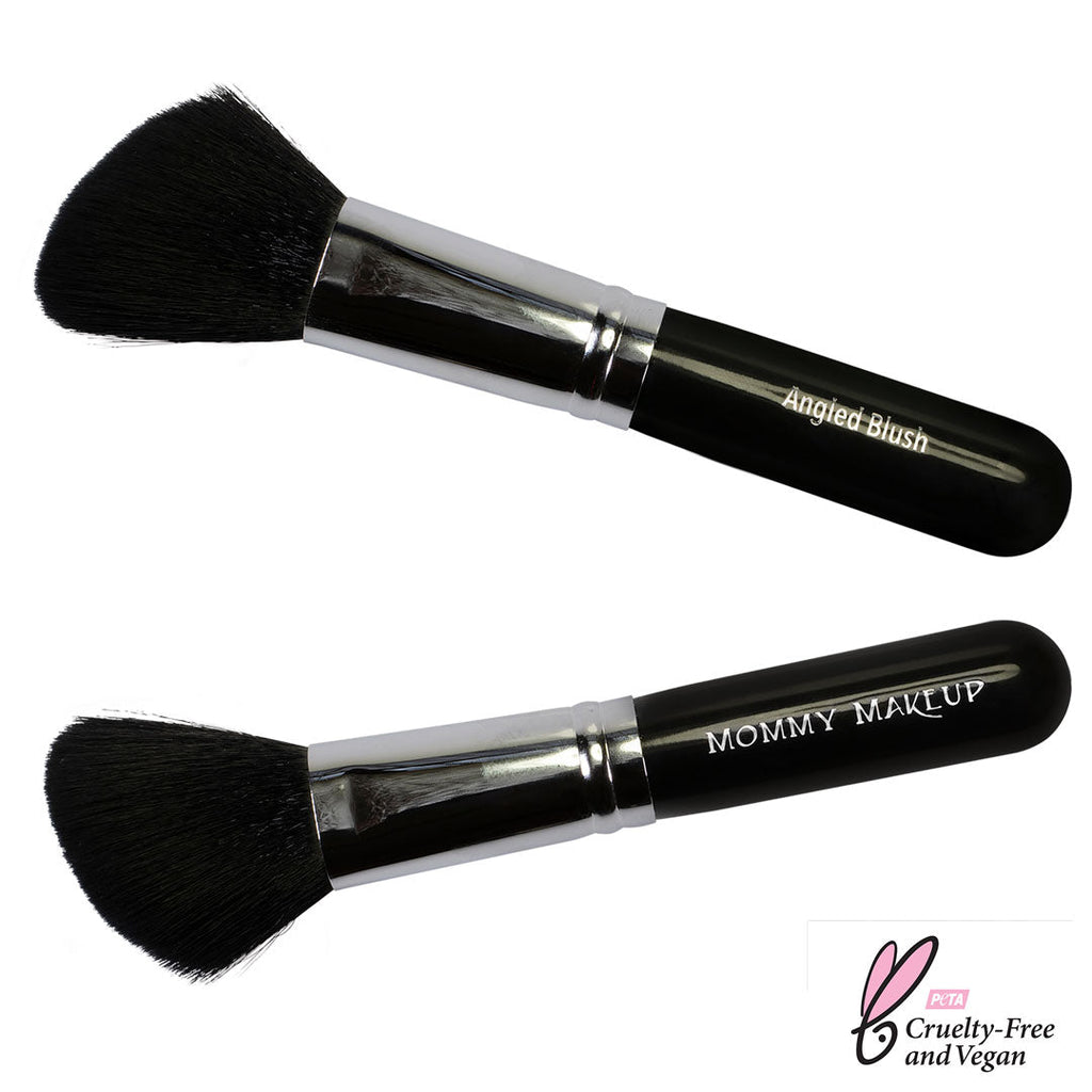 Two makeup brushes with black bristles and silver handles on a white background, labeled 'Angled Blush' and 'Mommy Makeup'.